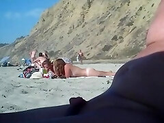 2 nymphs make fun with a guy's microdick on a nudist beach