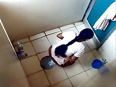 Some inexperienced Indian dark-haired gals peeing in the toilet on voyeur cam