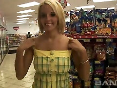Cute blond haired lady flashes her pierced pussy in the shop