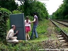 A guy jerks off while watching a couple ravaging outdoors