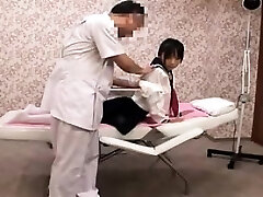 Pigtailed Japanese girl with puffy tits gets massaged and f