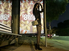 Crossdresser waiting for bus in short dress at night Crossdresser waiting for bus in short dress at night