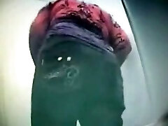 Hidden cam flick caught big bum of Russian brunette in the public toilet