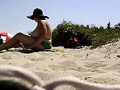 Big breasts laying out at the beach