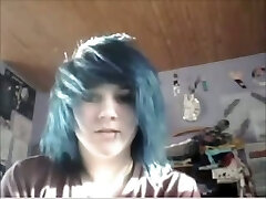 Blue haired fledgling emo girl with pierced lip was rubbing her pleasure button
