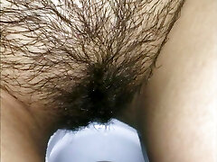 COLLECTION A girl pisses in the toilet, a black-haired pisses in her panties and in the dishes. Hairy pussy close up
