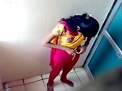 Some first-timer Indian brunette gals pissing in the toilet on voyeur cam