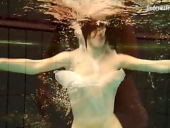 Shaved Andrejka with big tits in the pool