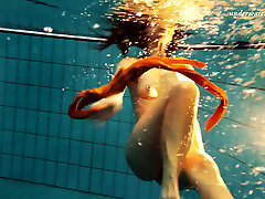 Mind-blowing orange stockings of Markova underwater