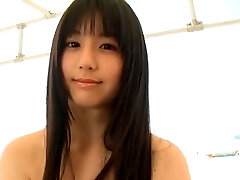 Svelte Japanese sweetie runs around the beach in lil yellow bikini