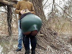Squeezing my mummy in law's fat rump in a leather miniskirt before she helps me pee outside