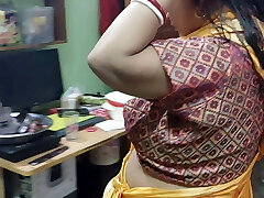 Today Salu Bhabhi was looking hot in a yellow saree. husband porks a pile