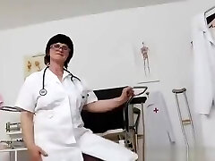 Brunette practical nurse examining her vagina