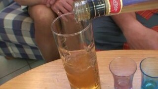 Blonde grandma takes two big cocks at once