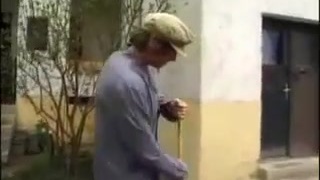 Laundering mature housewife in grey Tights and curlers