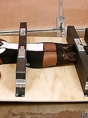 Bondage virgin Lexy gets locked in a contraption on the floor. Watch this fabulous female in distress struggle even though her neck, palms, torso and feet are padlocked.