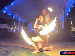 Amateur couple watches a fire show and has strapon amateurs sex once back in the hotel