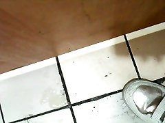 Korean girl sucks asian lady squirts uncensored in a bathroom gloryhole and gets cum