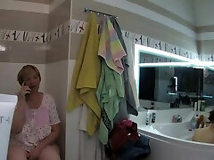 mom and daughter use the bathroom