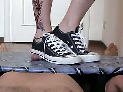 Mistress Elle in converse stomp her slaves cock on gil and hars table