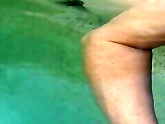 Horny bella rubbing cock in public pool