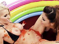 Two sophie dee and stephanie cane lesbians are rolling in the mud pool and having some soft BDSM action