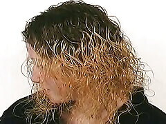 A slim blonde girl slave enjoys getting warm wax all over the body