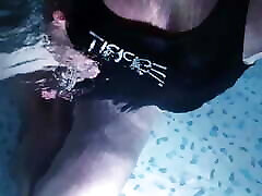 Sissy wearing Black one piece swimsuit on swimming pool