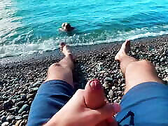 Skinny twinky sucked the big of a stranger jerking off to him on a public beach