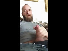 Hot bear strokes his dick and cum