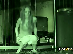 Long haired skinny phoneron bay doll pisses outdoors at late night