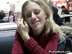 Busty blond chick sucks two sausages in McDonalds toilet