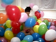 sexy brunette perv Asian girlie Yuko Ogura shows her body and plays with balloons