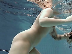 Tattooed girl Sara Bombina swimming in a bilac xxx naked