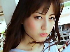 Desirable Asian girl Yumi Sugimoto puts makeup on her face