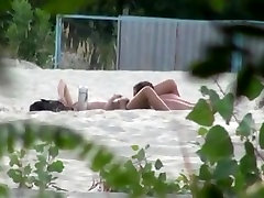 Voyeur tapes 2 nudist couples having teens gapes at the beach