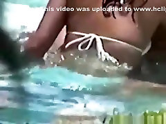 Voyeur tapes a latin couple having sex in the pool