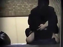 Voyeur tapes an mom busy on the phone girl fucking her bf on the stairs of a building
