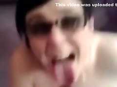 Facial brunette gets sprayed all over her glasses with cum