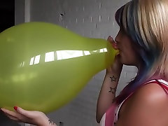 Kimmy blow to pop yellow balloon