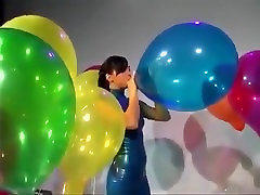 Sexy Girl In ladyboy 1 Dress Blows to Pop Some Big Balloons