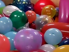 Single woman around balloons