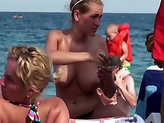 Beautiful mom baking with son on the beach