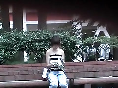 Public sharking video features a cute Asian girl getting her tits exposed.