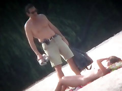 Spy cam shot of a hot naked woman taken on the beach