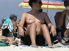 Big breasted coquette sunbathing on a cinnabelle sex beach