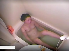 Asian babe taking a bath and shot by a hidden cam