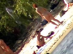 Nude couples relaxing on the beach and shot on cam