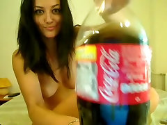 Mesmerizing raven-haired girl masturbates during online chatting