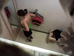 office brazzer com changing room camera captures busty chick trying on clothes